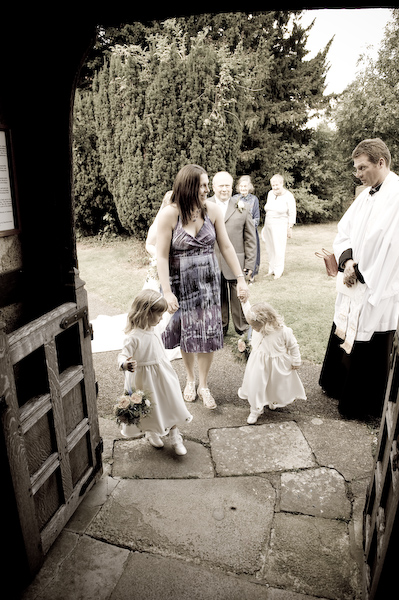 Flower girls make their way inside
