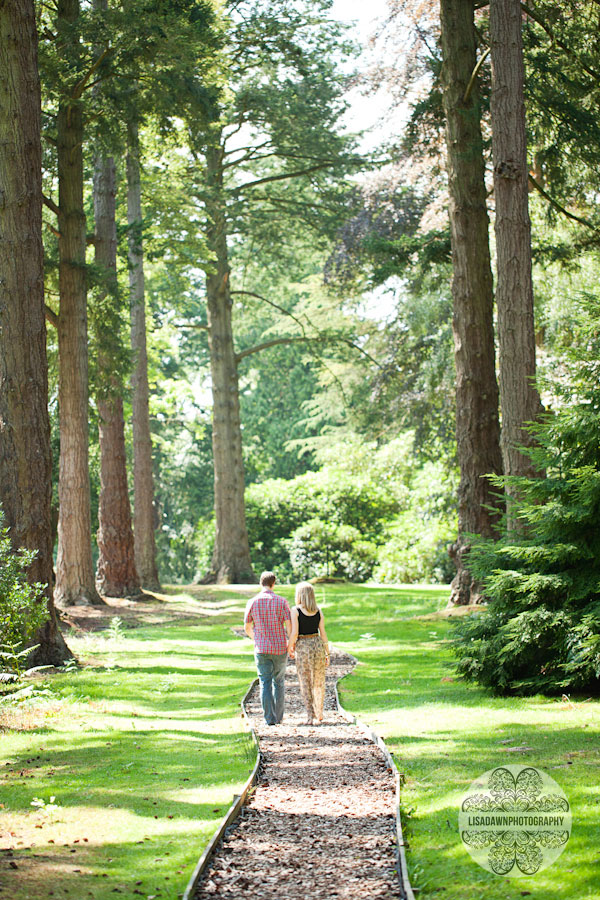 Couple walking through the woods engagement photographer