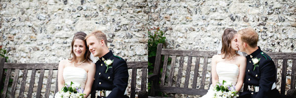 bride and groom sitting on a bench