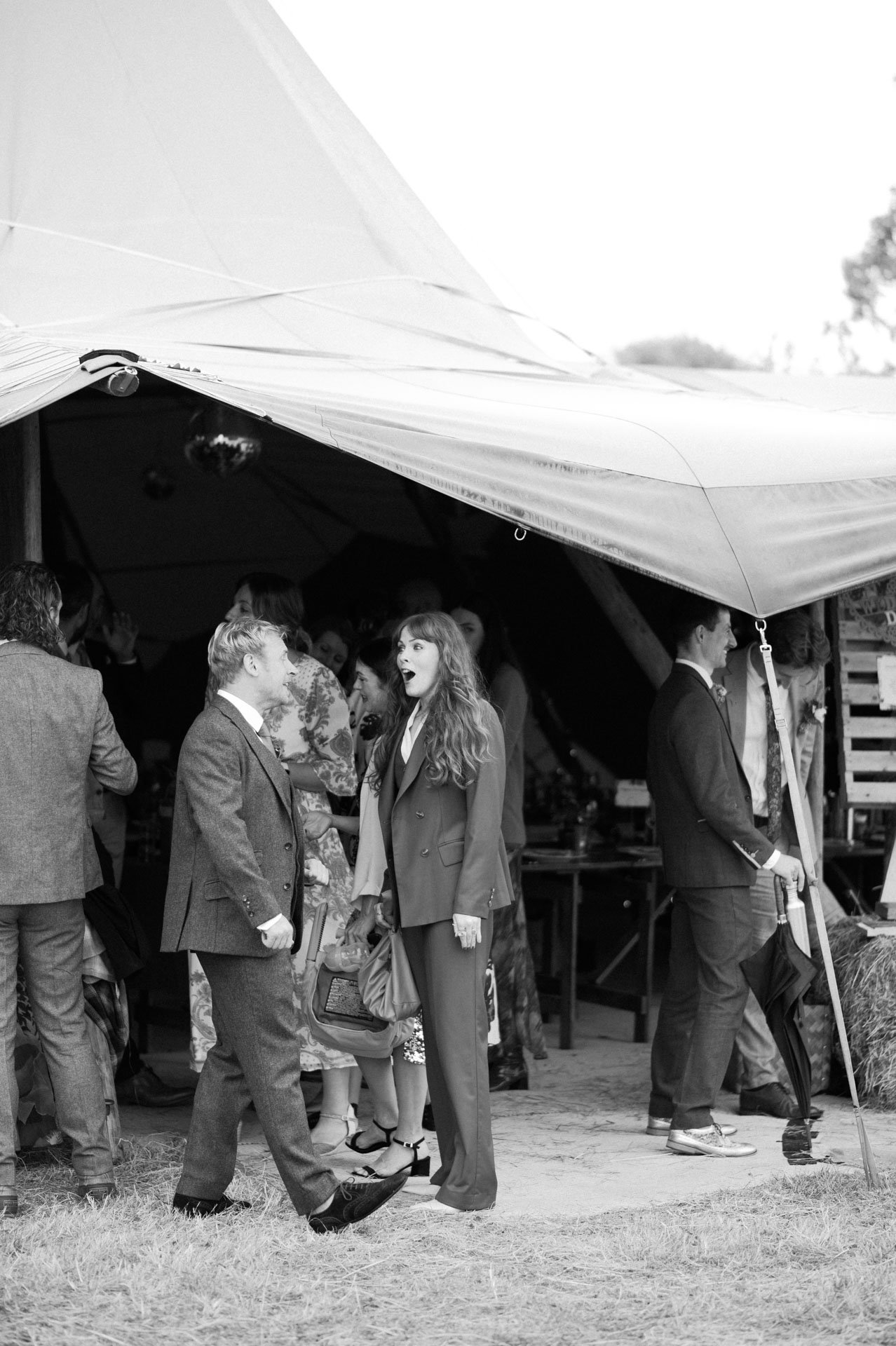 Hannah and Alex standing outside the tipi after the ceremony