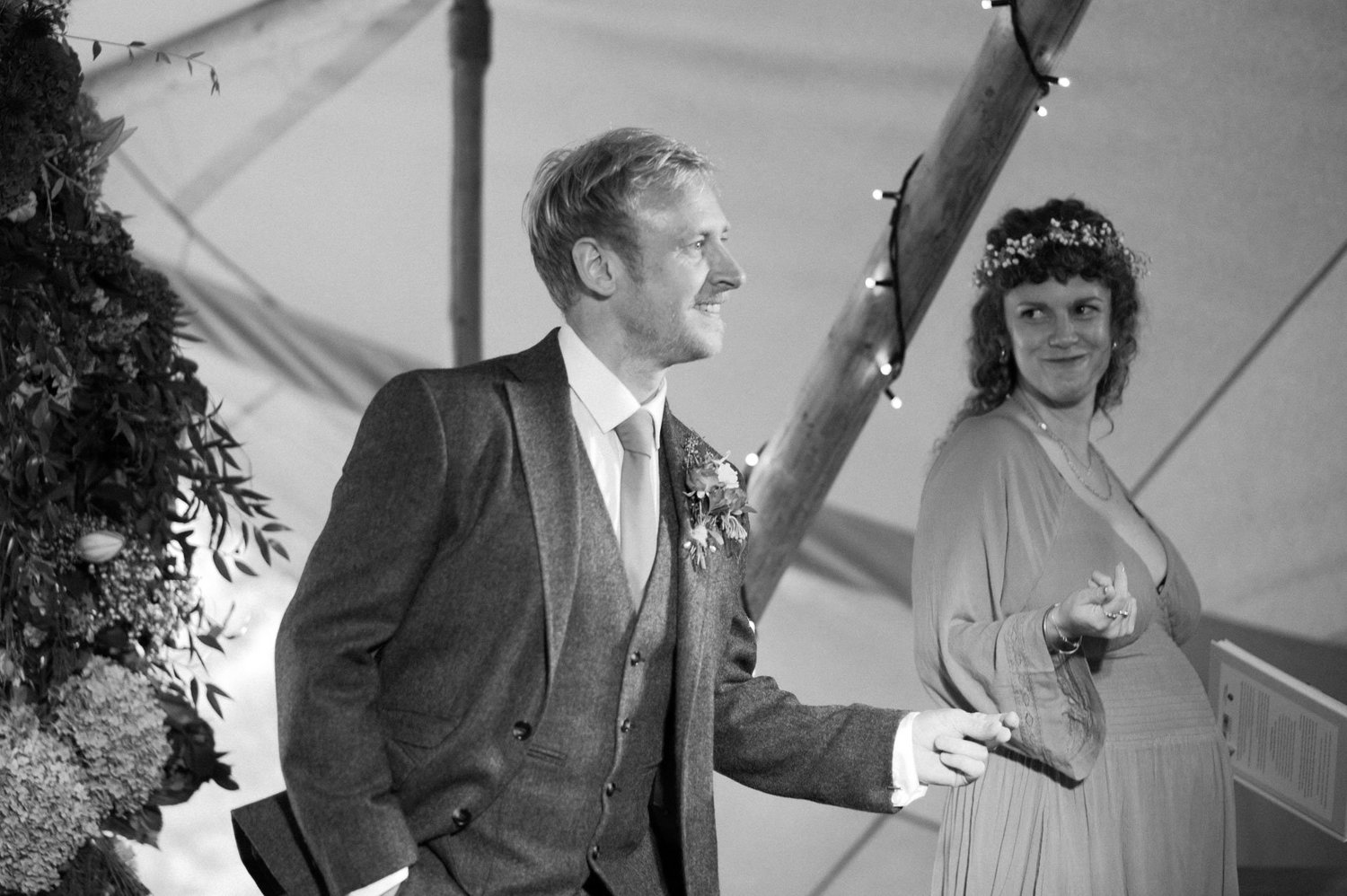 Alex smiling while waiting at the front of the ceremony