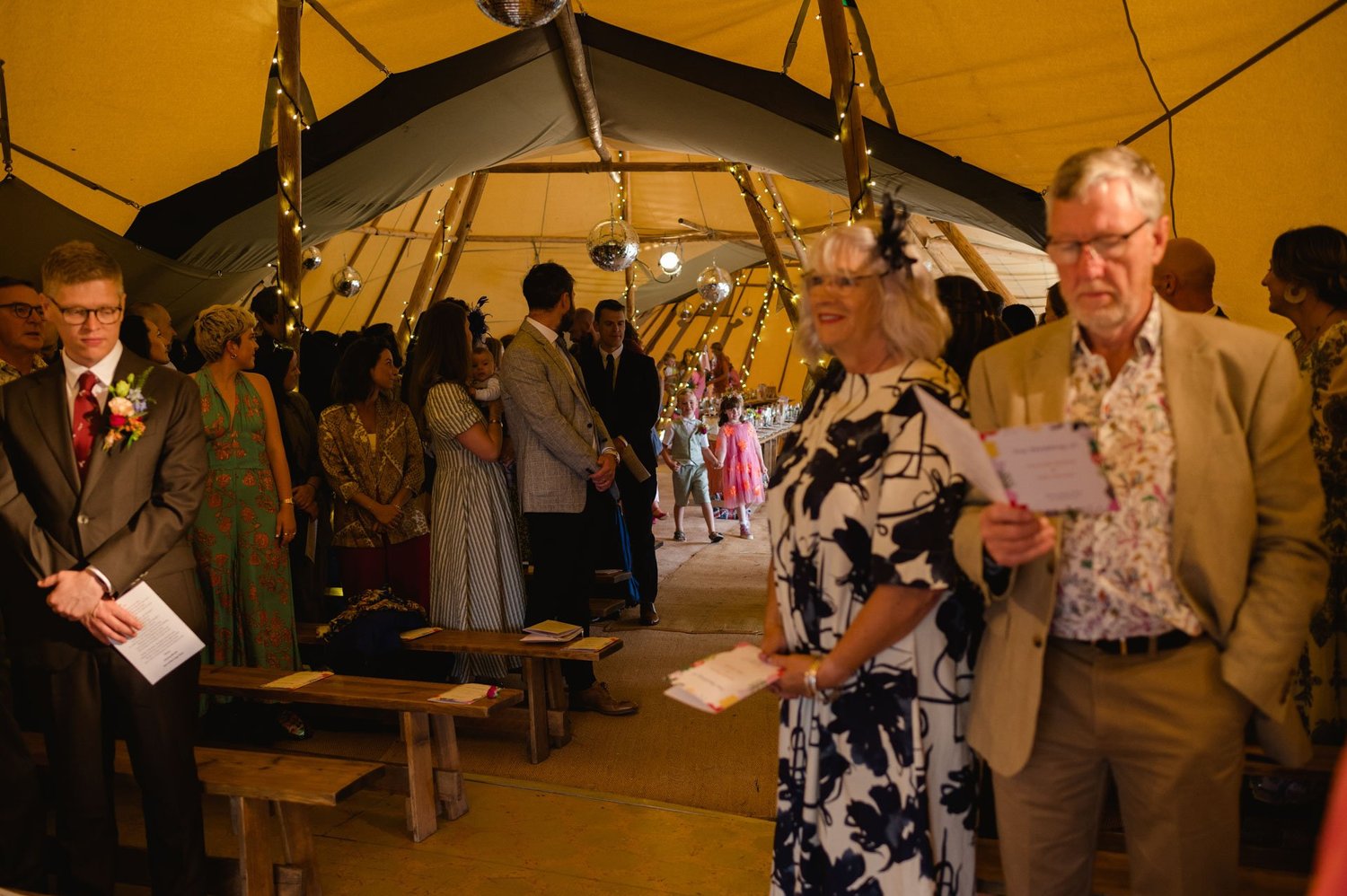 Family members giving a reading during the tipi ceremony