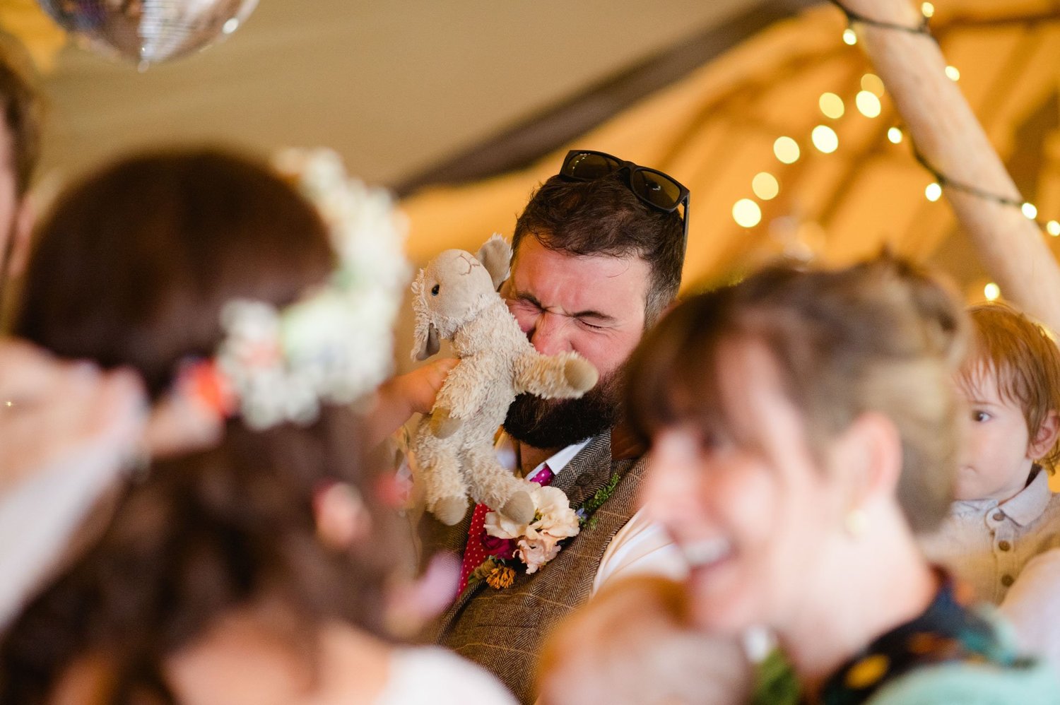 Alex hugging a guest during the reception