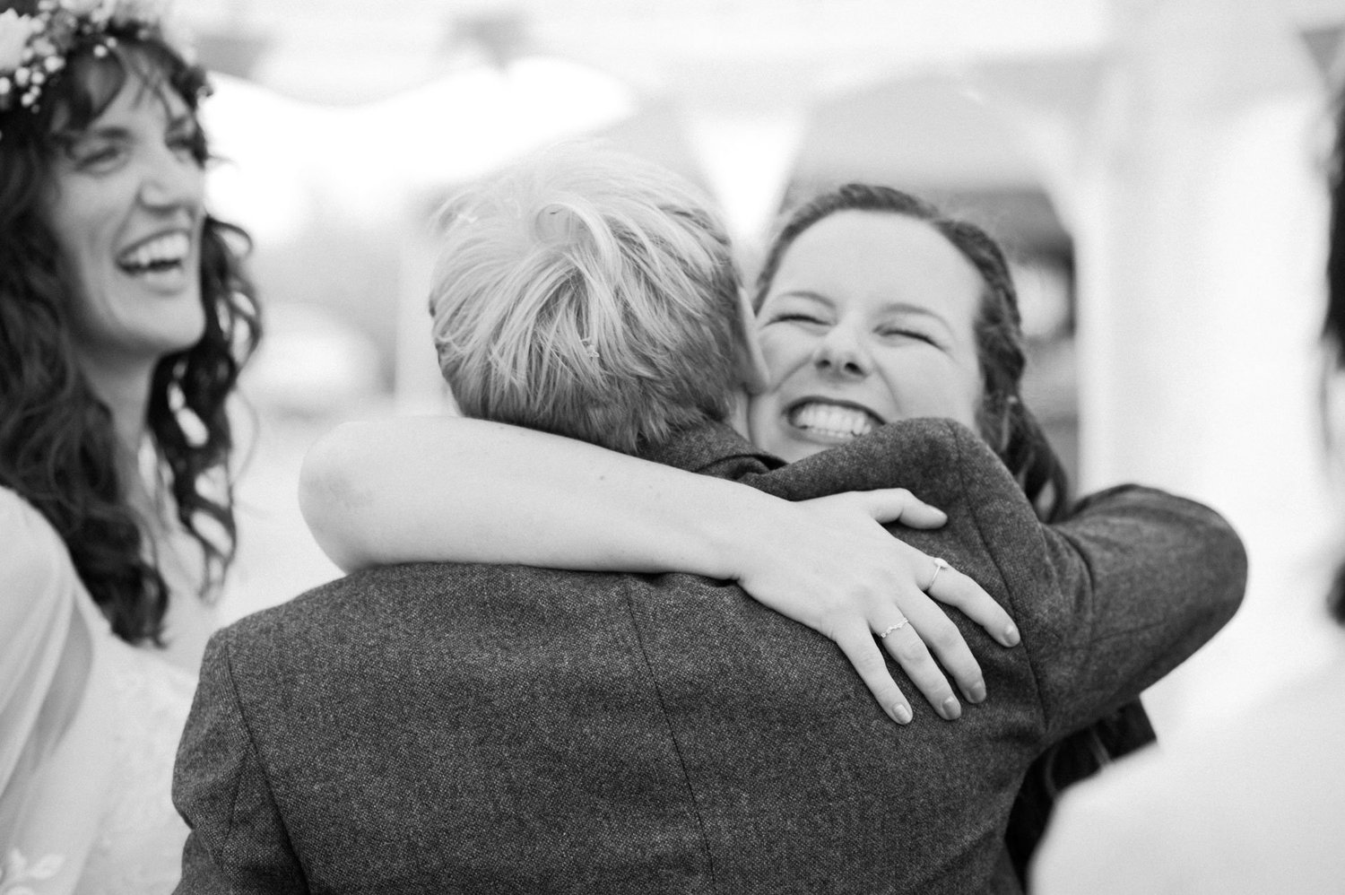 Hannah hugging a guest during the wedding reception