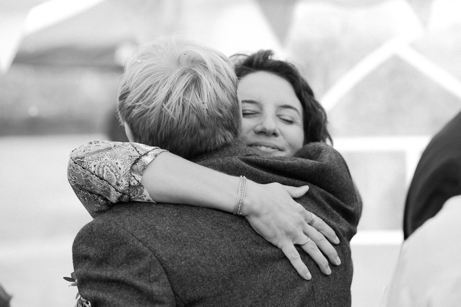 Hannah embracing a guest after the tipi ceremony