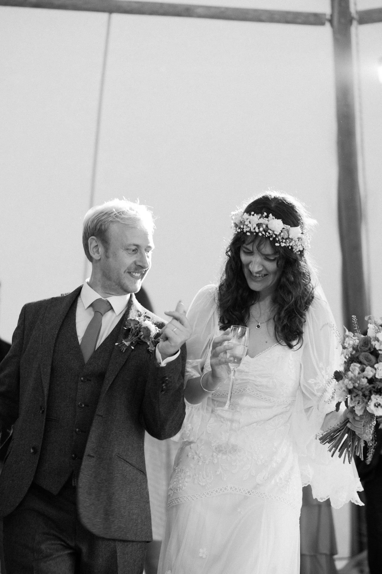 Hannah and Alex laughing together after their ceremony