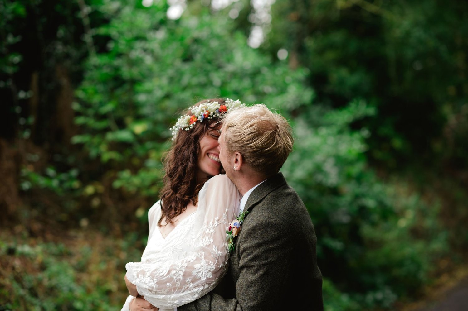 Hannah and Alex sharing a close portrait among the greenery