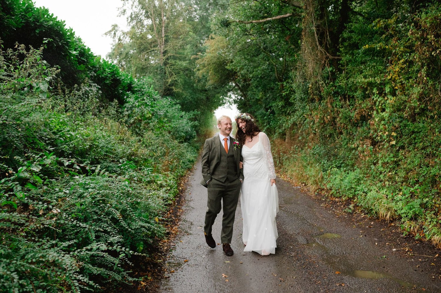 Hannah and Alex walking arm in arm through the lane