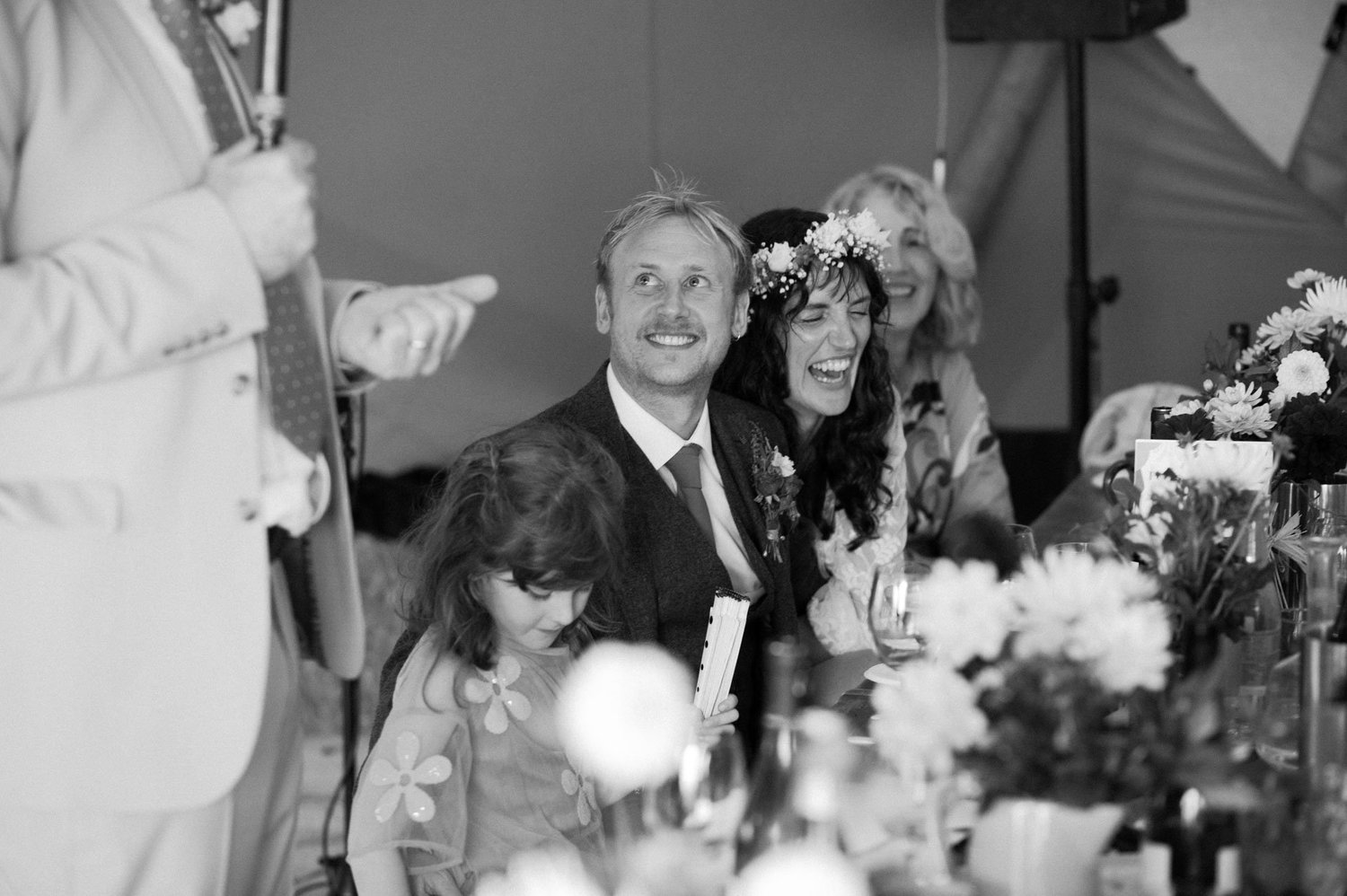 Hannah and Alex laughing at the top table