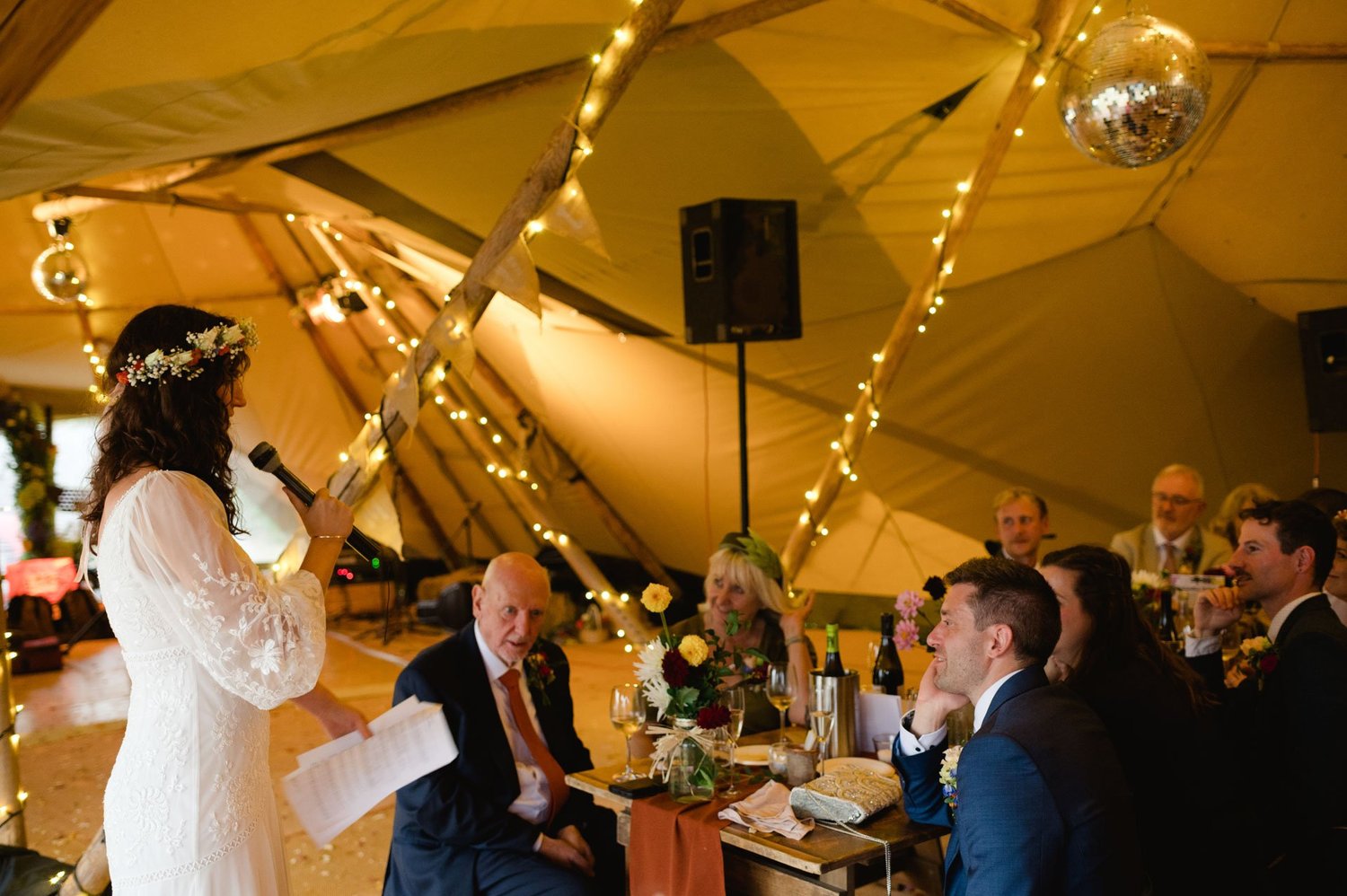 Hannah speaking to seated guests during the wedding breakfast