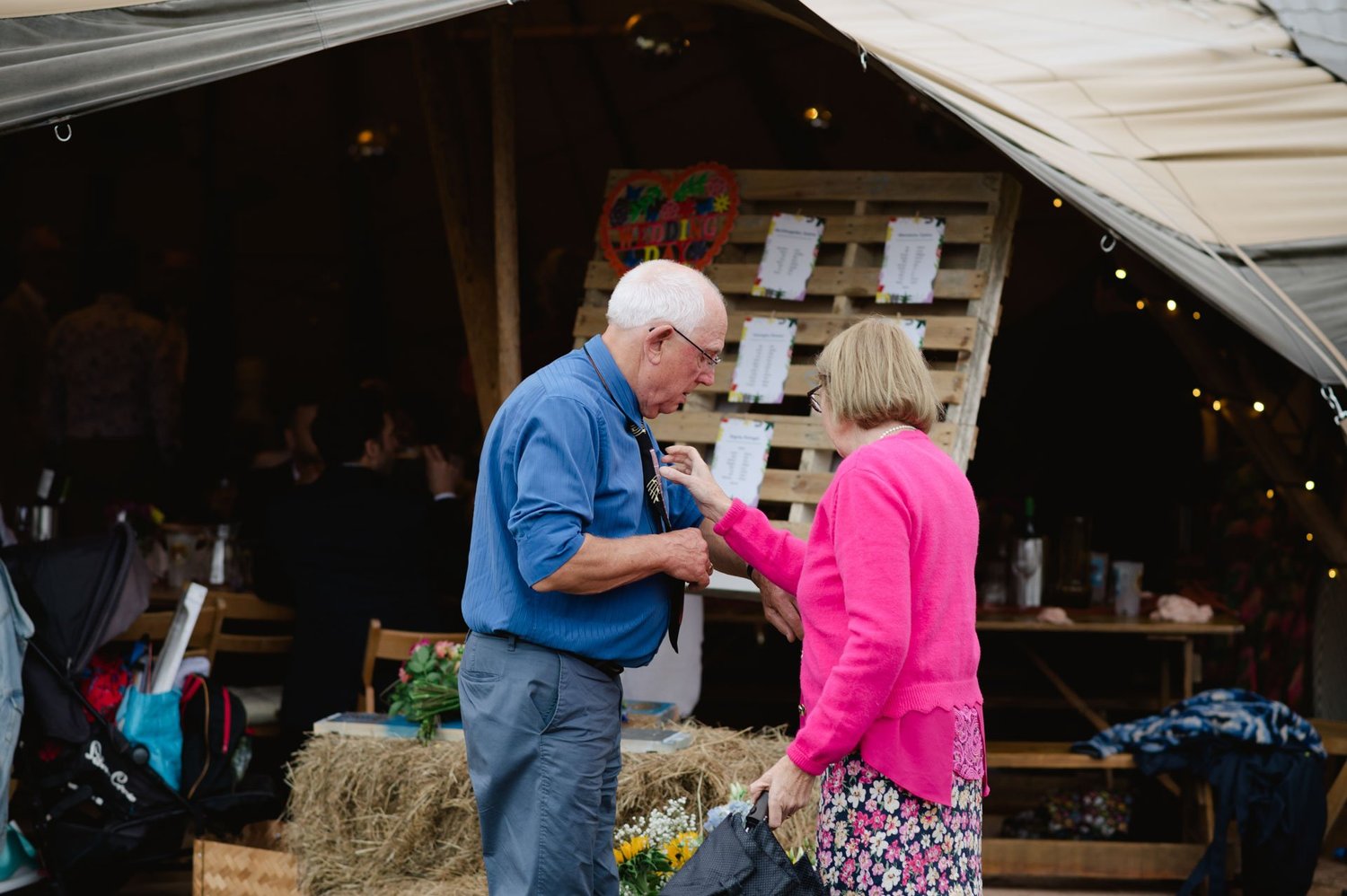Guests dancing together in front of the open barn