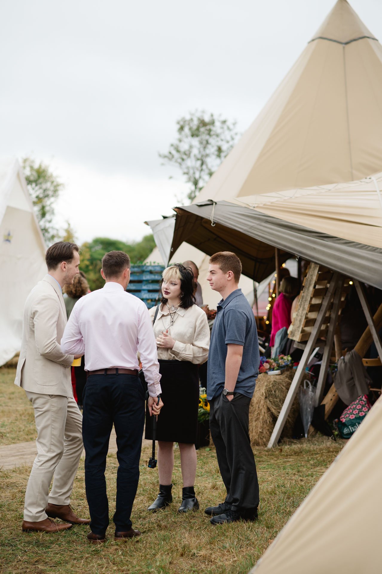 Guests chatting between the tipi and outdoor bar