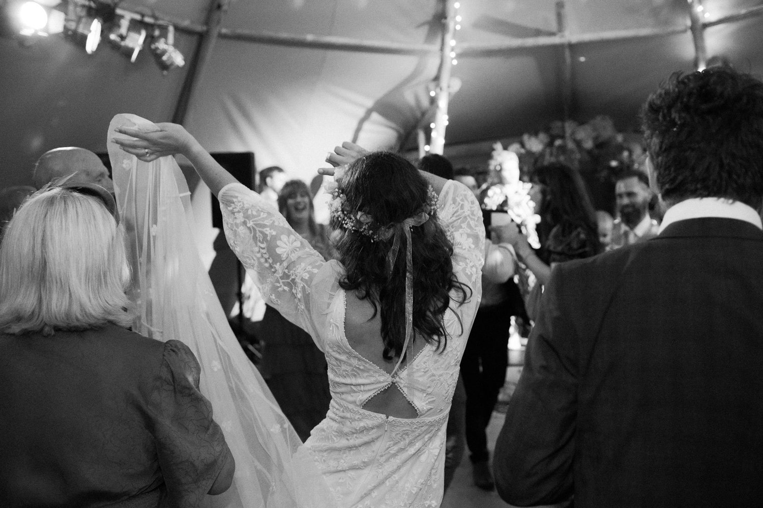 Hannah twirling her veil on the tipi dance floor