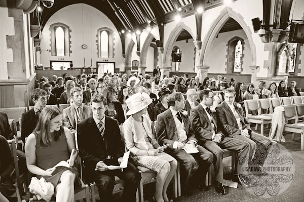 Wedding guests sitting in church