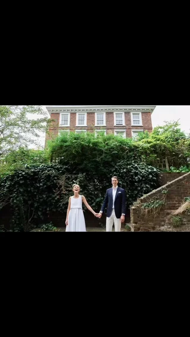 A wedding couple walking outside