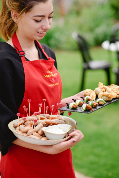 Catering staff carrying canapes